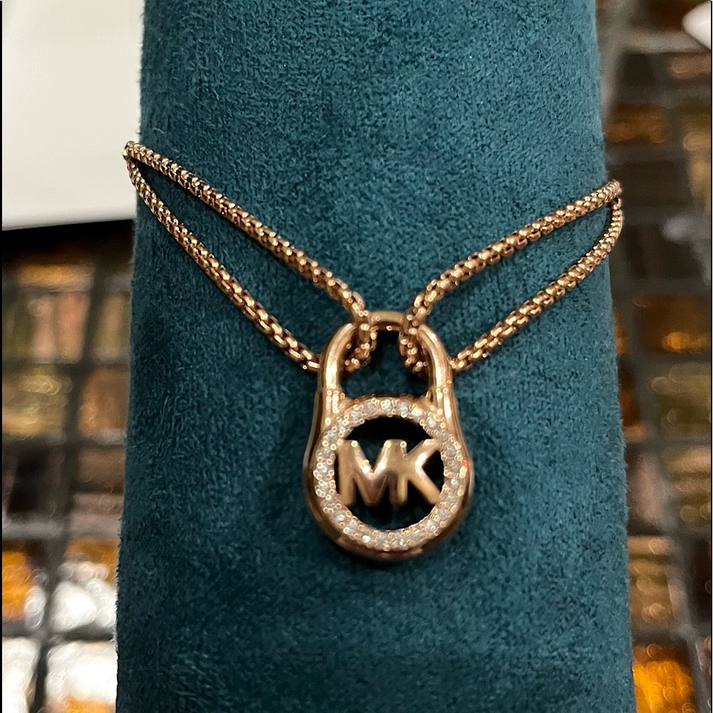 Nitb MK Silver tone bracelet by Michael Kors Circle Lock charm